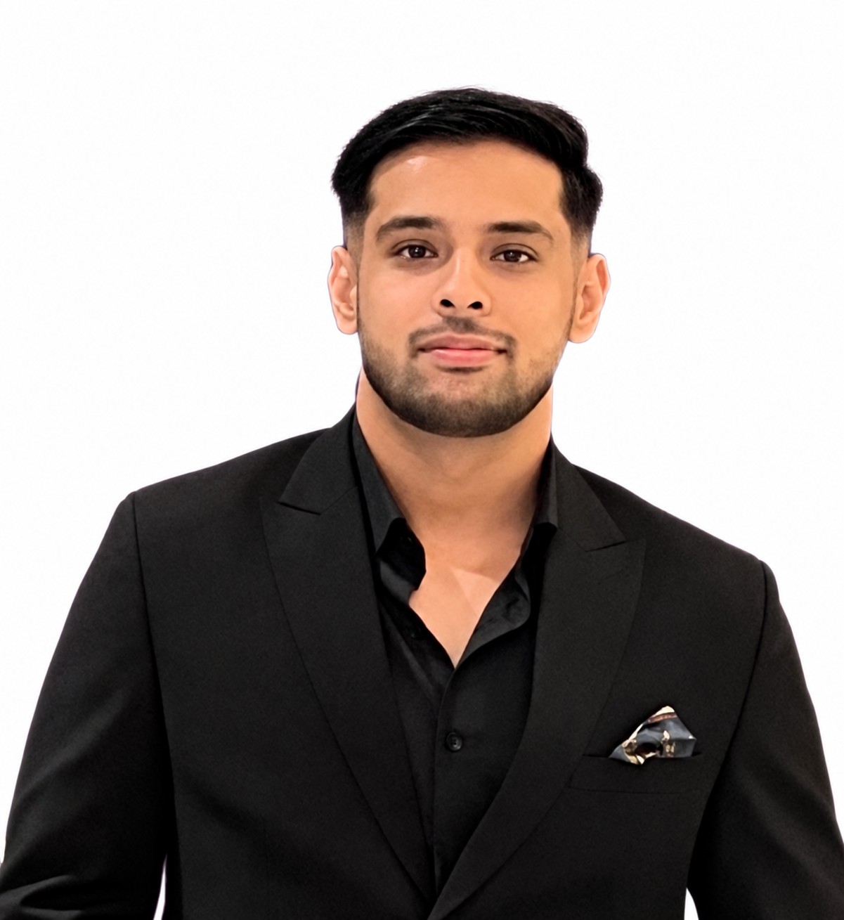 Wasif Hussain wearing a black blazer against a white background